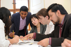 International students studying around a table